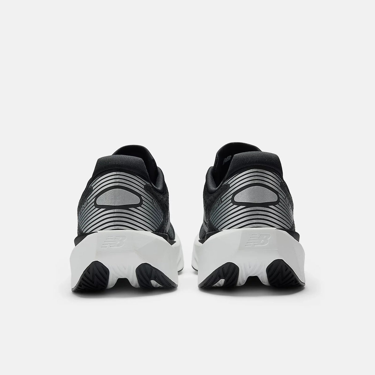 Buy New Balance Men FuelCell Rebel V5 Wide - Black / Silver Metallic for running in Singapore - Running Lab SG